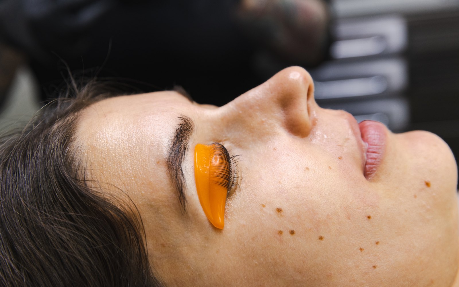 Side view of lashes lifted onto an orange silicone shield