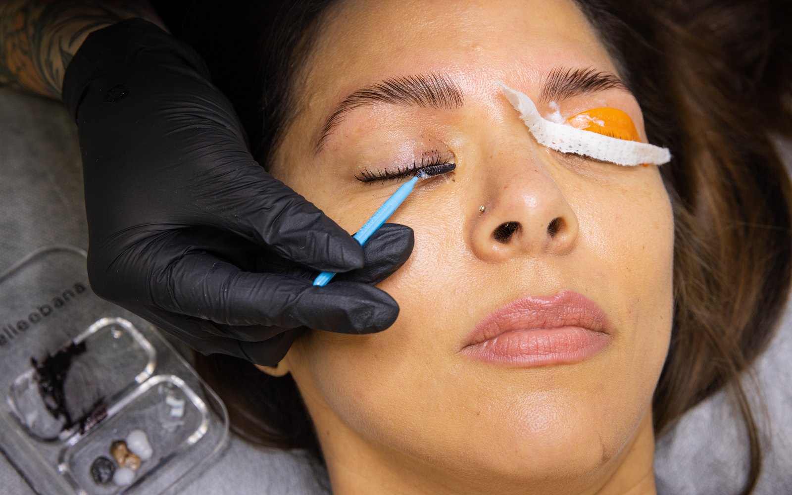 Mixed lash tint in an Elleebana tray during a lash tint service